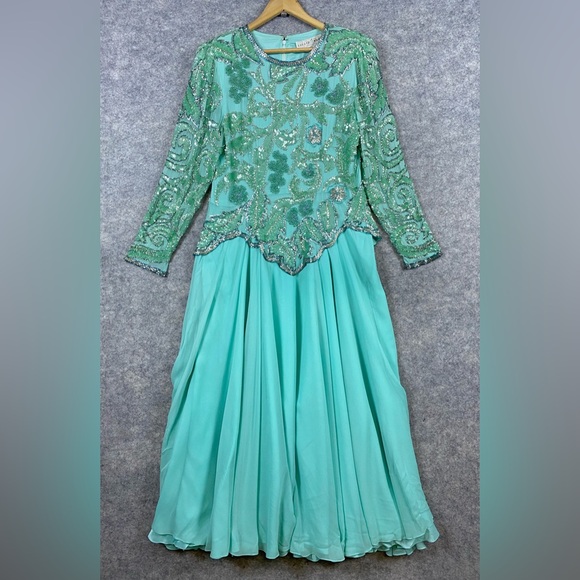 lillie rubin beaded dress Vintage Lillie Rubin You're sure to turn heads in this stunning vintage Lillie Rubin dress. The dramatic low back and intricate beading create an elegant yet sultry silhouette perfect